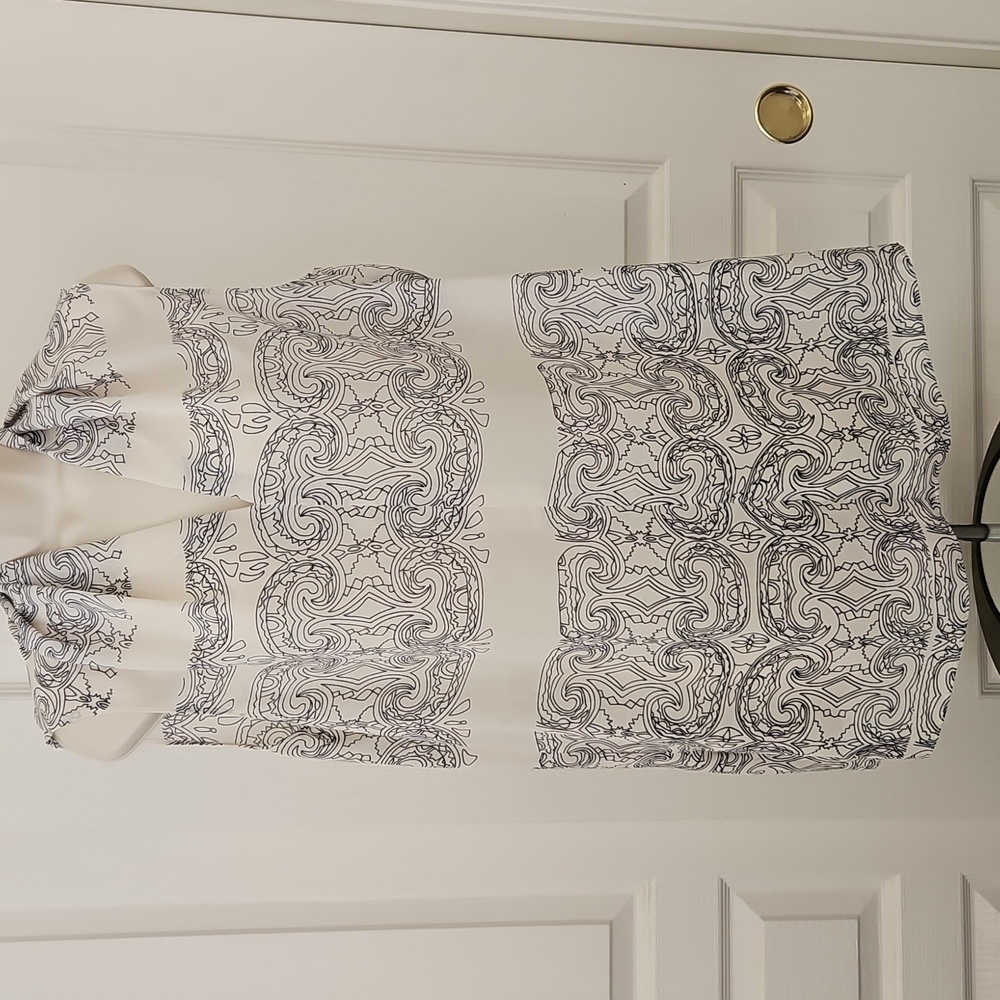 Cabi | Scrollwork sleeveless tunic top in ivory and navy polyester chiffon. 